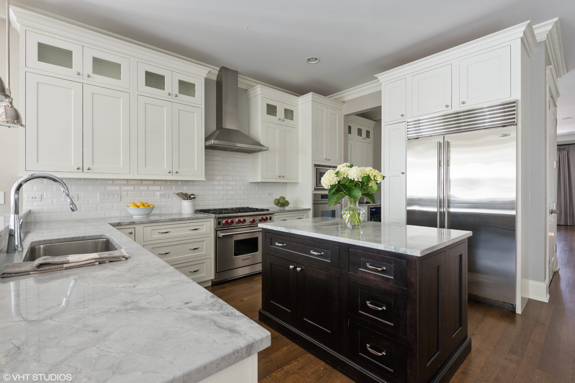 White, gray kitchen space with kitchen island