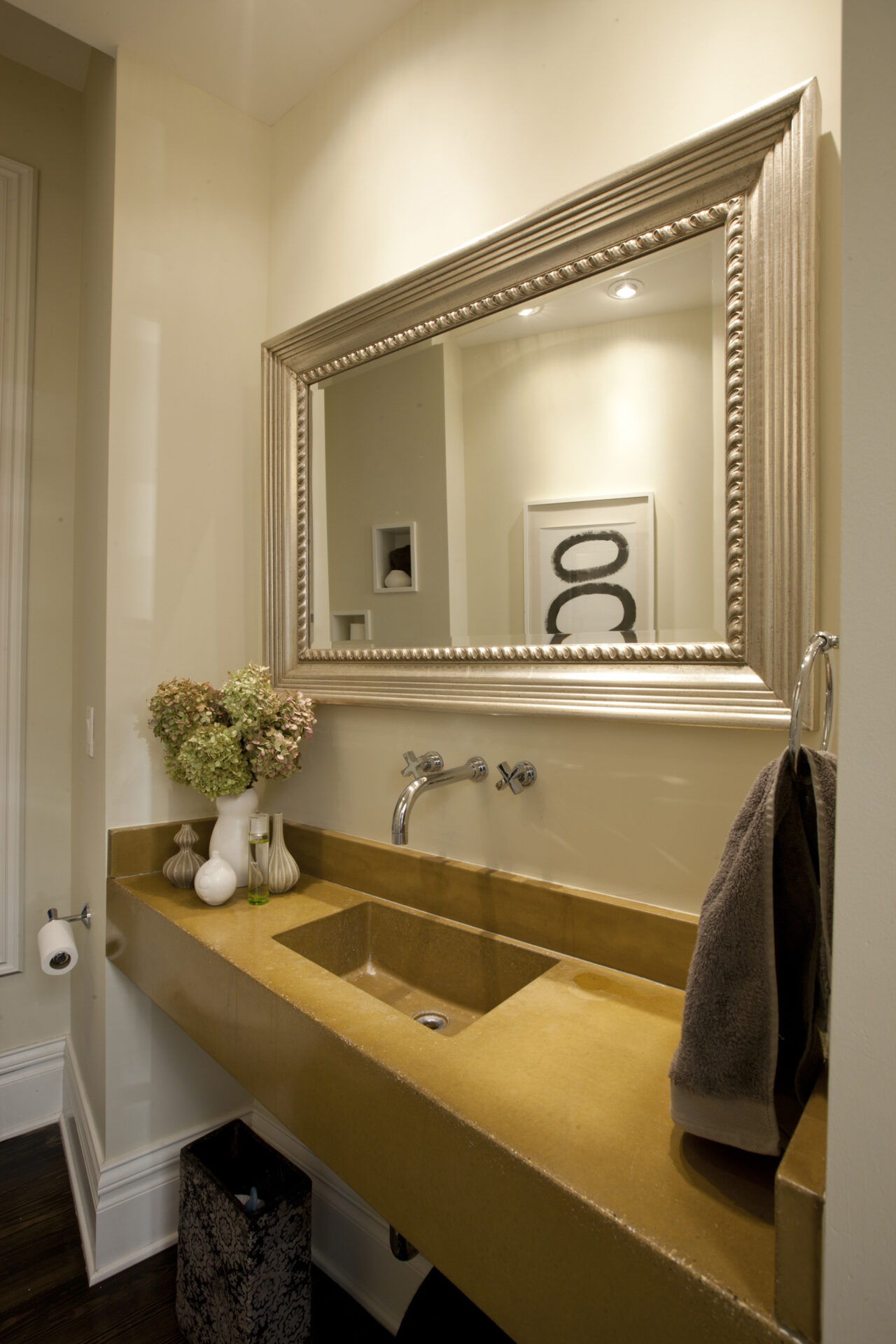 elegant sink and countertop with framed mirror