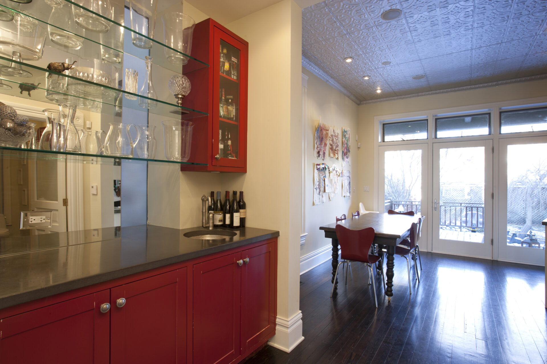 contemporary kitchen space with accent tiles, art, and furnishings