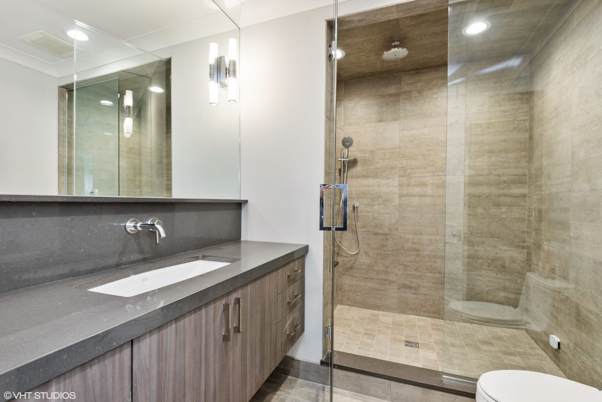 bathroom with sink and shower, ambient lighting