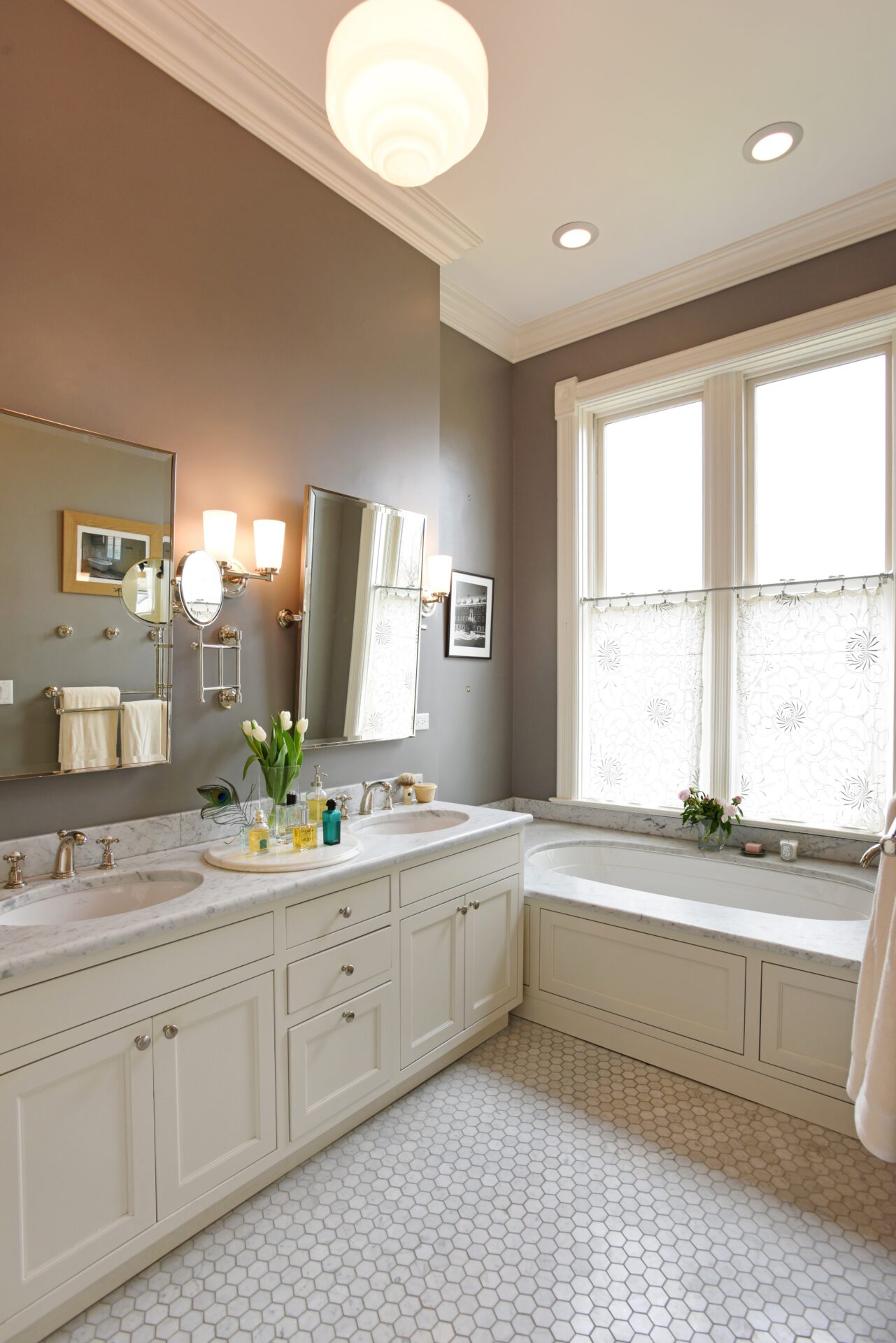 white bath space with tub and sinks