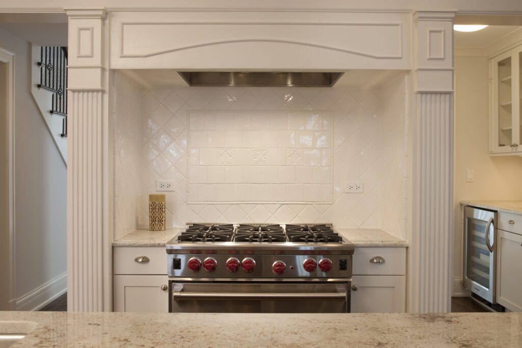 Stove cooking area with white tiles